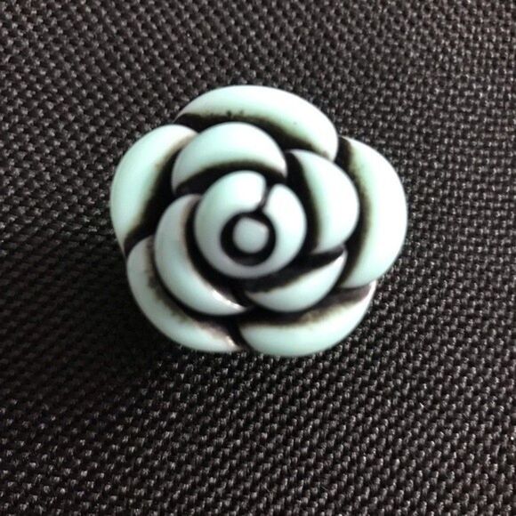 Black and light blue “rose ring” which has an adjustable ring band. - Picture 1 of 3